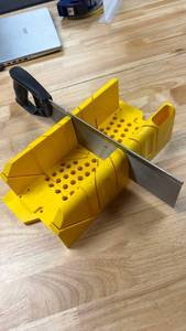 lot 109 image: Yellow Miter Box with Saw - Retail $50