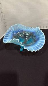lot 1017 image: Blue opalescent glass ruffled bowl featuring a palm and scroll pattern 4x9