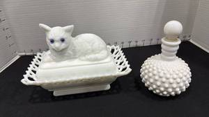 lot 1021 image: West Moreland 2 pc dish with cat (flaw on one corner) and white milk glass hobnail perfume bottle and stopper needs new cork