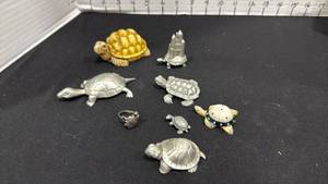 lot 1026 image: Metal and other turtles with turtle ring
