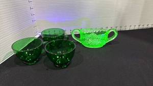 lot 1033 image: Uranium glass 2 handled sugar dish and 3 cups