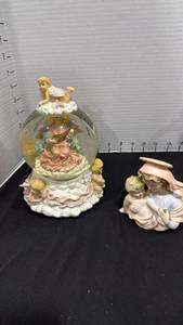 lot 1072 image: Angel Cherub musical Snow Globe Figurine  and porcelain Madonna and child figurine