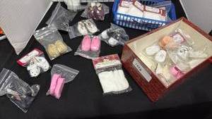 lot 1073 image: Doll shoes and doll tights