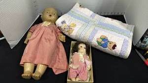 lot 1083 image: Vintage Composition doll and bisque doll with baby quilt