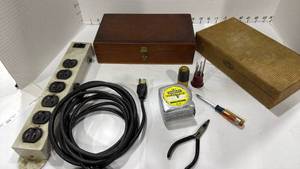 lot 1112 image: Power outlet, 2 boxes, Stanley tape measure, small pliers and screwdriver