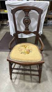 lot 1124 image: Victorian or Eastlake-style wooden chair with arms and a needlepoint upholstered seat 34x16x21 seat 16 inches