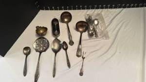 lot 1256 image: Silver plate spoons, childs set, souvenir spoon, strainer and more