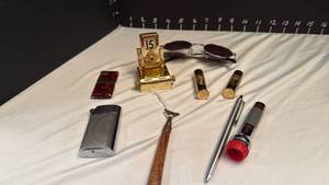 lot 1262 image: Vintage strainer, lipstick , lighters and more