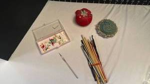 lot 1264 image: Pincushions, crochet hooks and straight knitting needles and more
