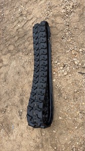 lot 251 image: Unused MINI Rubber Track Loop with Multi-Bar Tread Pattern