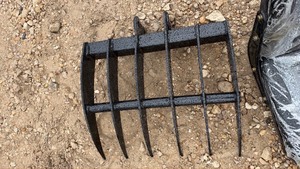 lot 274 image: Unused MINI EX Grapple Attachment with Curved Tines and Pin Mounting Lugs