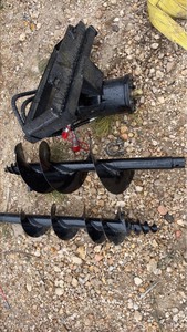 lot 717 image: Unused MINI EXCAVATOR Auger Drive Attachment with Two Auger Bits