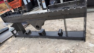 lot 4055 image: Unused Wolverine Skid Steer Pallet Fork Frame with Hitch Adapter and Bale Spear Holder