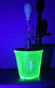 lot 100 image: Uranium Glass Graduated Measuring Cup Container with Hand Crank Egg Beater Green Handle