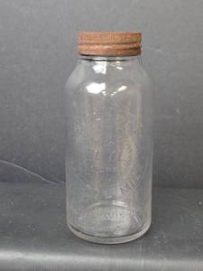 lot 102 image: Vintage Horlick Embossed 20oz. Malted Milk Bottle with Metal Lid