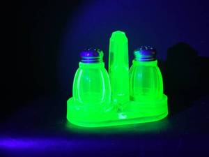 lot 106 image: Uranium Glass Salt and Pepper Shaker Set with Holder
