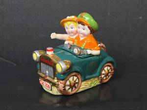lot 112 image: NIB Campbells Kids 100 Years Going Places Salt and Pepper Shaker Set