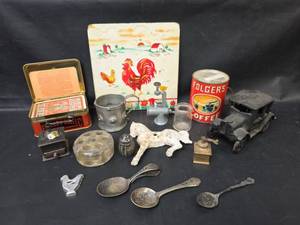 lot 140 image: Assorted Collectibles - Folgers Coffee Puzzle Can, Cast Iron Car, Spoons, and More