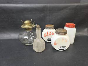 lot 157 image: Lot of 3 White Glass Salt and Pepper Shakers, Clear Glass Oil Lamp Base, and Textured Bottle