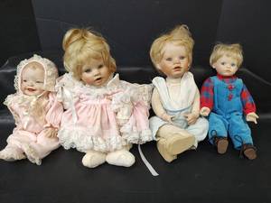 lot 291 image: Vintage Porcelain Baby Dolls with Soft Bodies and Vintage Clothing