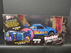 lot 345 image: NIB EX RC Rockin Roadster, 118 RC Car with Remote