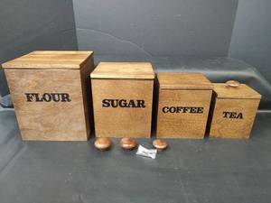 lot 374 image: Four Piece Canister, Wood with Plastic Liners and Wood Lids