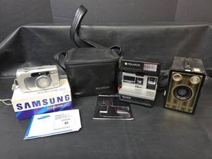 lot 454 image: Vintage Samsung Maxima Zoom 105Ti, Polaroid Sun 600 LMS, Brownie Junior Six-16 Cameras