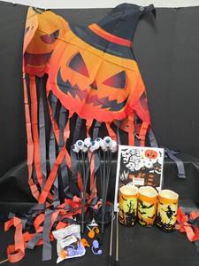 lot 473 image: Halloween Party Decor Lot with Pumpkin Flag, Solar Eyeball Stakes, 3 Flameless Candles and Straw Covers
