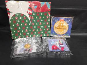 lot 481 image: Christmas Goodie Gift Boxes, 2 Sets of Metal Cookie Cutters and 60ct Assorted Christmas Napkins