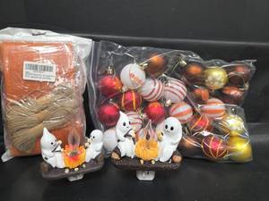 lot 486 image: Seasonal Decor Lot 2 Ghost Campfire Plug-In Night Lights, Fall Ornaments Bag, Burlap Ribbon and Twine