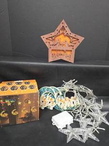 lot 506 image: LED Star and Moon Curtain String Lights with Star-Shaped Nativity Cutout Light