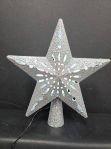 lot 514 image: Silver Glitter aprojection Star Tree Topper with Cutout Design and Cord