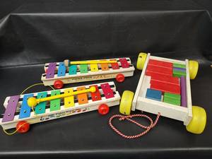 lot 543 image: Vintage Fisher-Price Pull-A-Tune Xylophone Pull Toys with Block Wagon