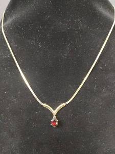 lot 605 image: Necklace V-Shaped Pendant, Pear-Shaped Red Stone with 18in Chain