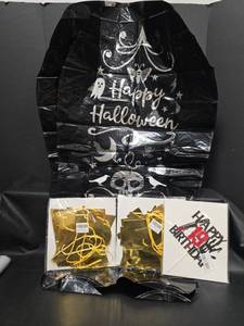 lot 647 image: 2 New Happy Halloween Mylar Balloon Tombstones, 2 Happy New Year Banners and Happy Birthday Sign