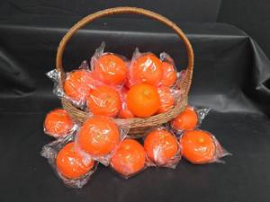 lot 655 image: Lot of Decorative Orange Fruit Pieces with Green Star Calyx, Individually Wrapped with Basket for Decor