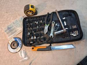 lot 11 image: Tool Kit Lot with Stanley Tape Measure, Sockets, Wrenches, Screws, Metal Cutting Disc