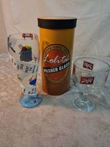 lot 18 image: Lolita Pilsner Glass with Lolita Collectible Beer Glass Set and Humorous Pint Glass Lot