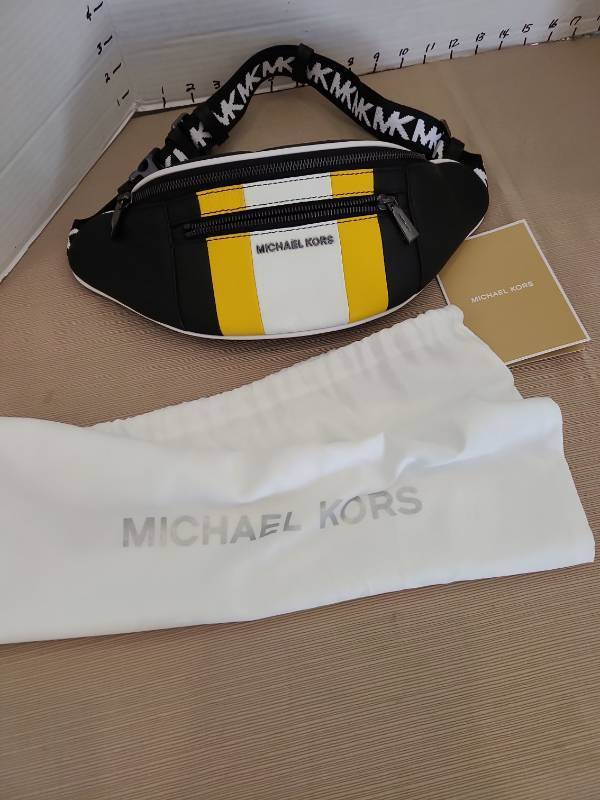 lot 1042 image: Michael Kors Belt Bag Black Yellow and White Striped with MK Logo Strap and Storage Bag