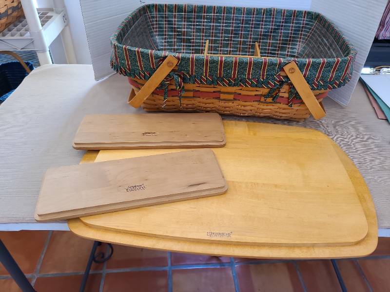 lot 1063 image: Longaberger basket 7.5x20.5x14.5 with handles, liners, dividers, plus two 12x4in. lids