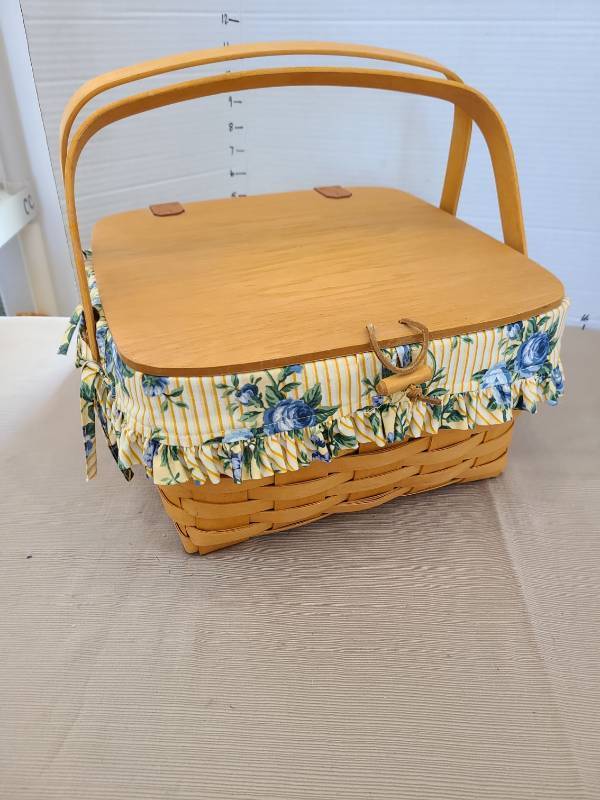 lot 1064 image: Longaberger basket with handles, fabric liner, leather hinges and latch, 6.5x12x12