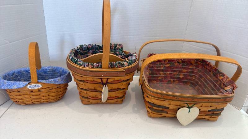 lot 1101 image: Longaberger Easter Basket with wooden divider, 1997 Bountiful Harvest basket and 2000 century celebration basket