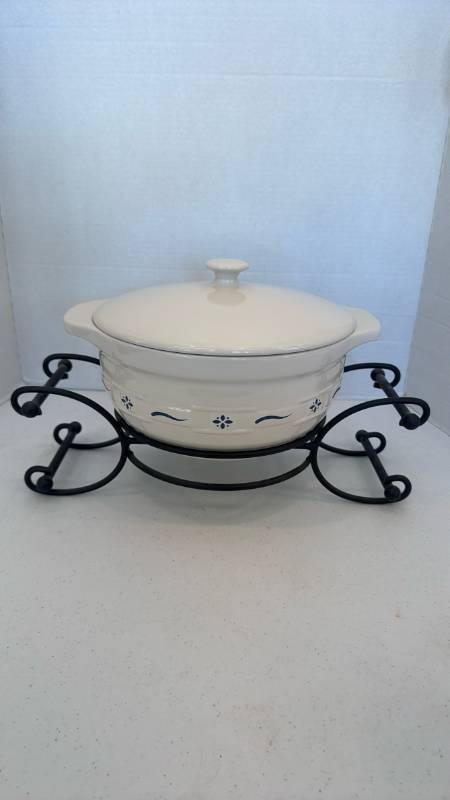 lot 1108 image: Longaberger Woven Traditions Pottery Heritage Covered Casserole with iron stand
