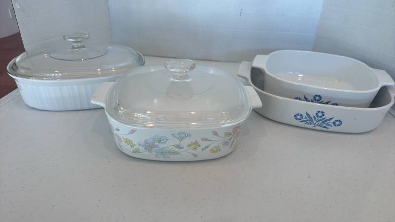 lot 1134 image: CorningWare casserole dish with lid in the Pastel Bouquet, blue cornflower casserole dishes and French white oval dish with lid