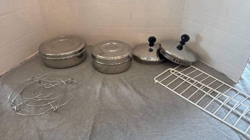 lot 1207 image: Lot of 2 Round Lidded Metal Containers, 2 Pot Lids, Wire Trivet and White Wire Rack