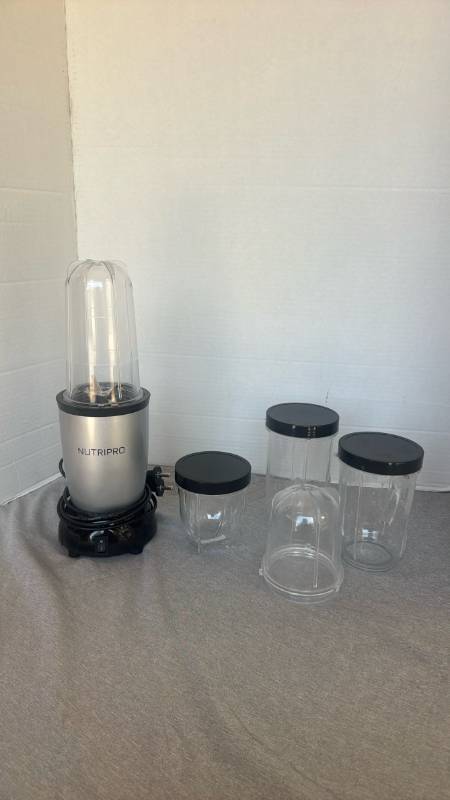 lot 1230 image: NUTRIPRO Blender Motor Base with Lidded Cups and 1 Extra Cup