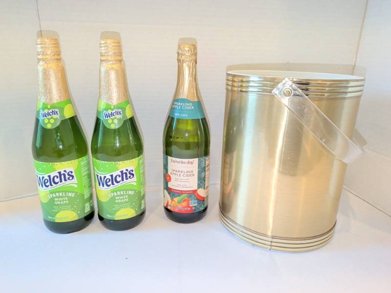 lot 1311 image: Welchs Sparkling White Grape Juice 750mL Lot of 2 with Favorite Day Cider and Ice Bucket