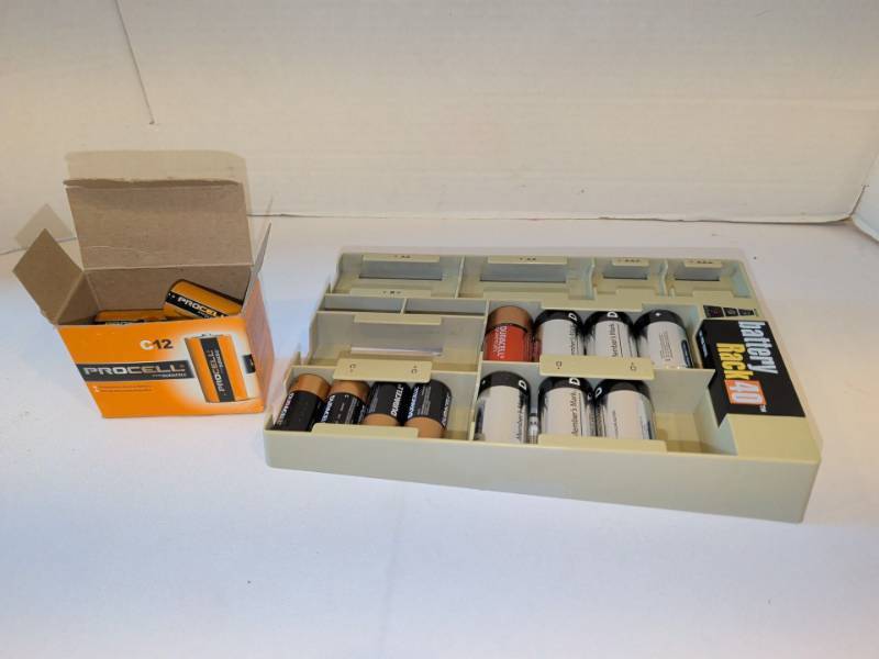 lot 1317 image: Battery Rack 40 Battery Organizer with Assorted Duracell Procell Batteries