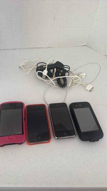 lot 1510 image: 4 old iPhones with chargers in cases