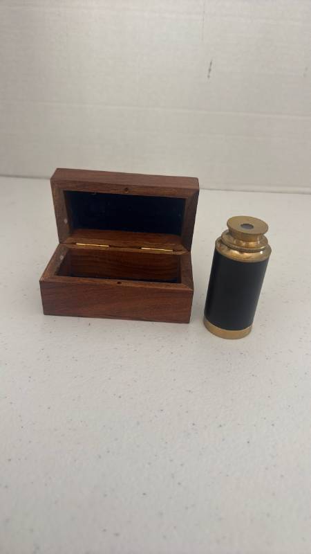 lot 1512 image: Small, 3 inch handheld brass and black leather nautical spyglass telescope inside a wooden storage box